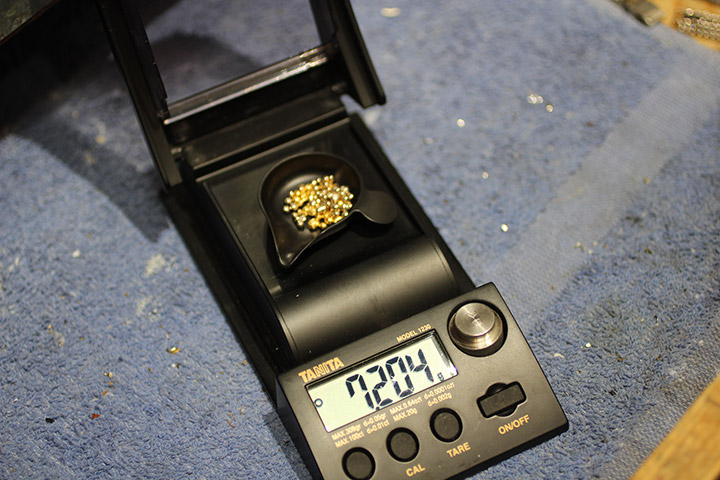 24K Fairtrade Gold grain being weighed out before it is formed into a wedding ring.
